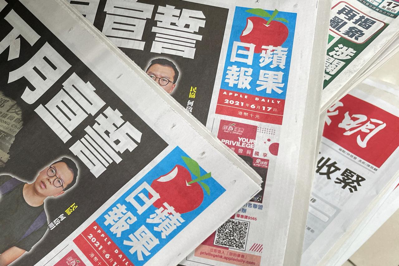 Copies of Next Digital's Apple Daily newspapers are seen at a newsstand in Hong Kong