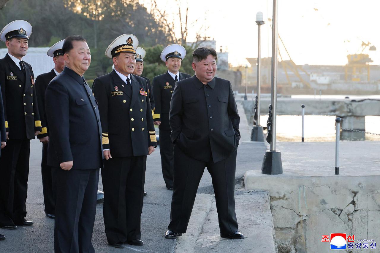North Korean leader Kim Jong Un observes a test-fire of strategic cruise missiles and anti-warship missiles from the destroyer Choe Hyon
