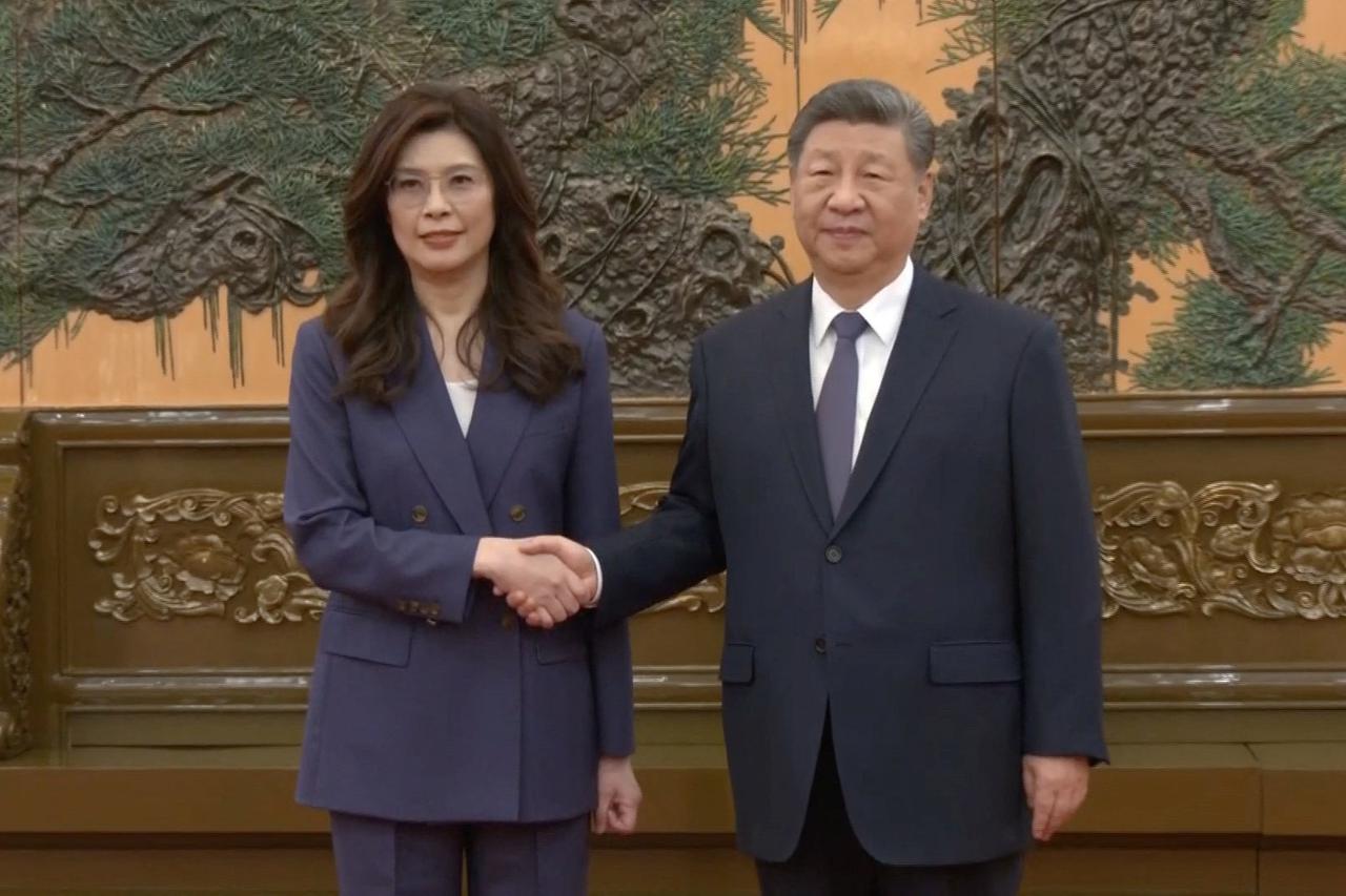 Cheng Li-wun, chairperson of the Kuomintang (KMT), Taiwan's largest opposition party, shakes hands with Chinese President Xi Jinping in Beijing