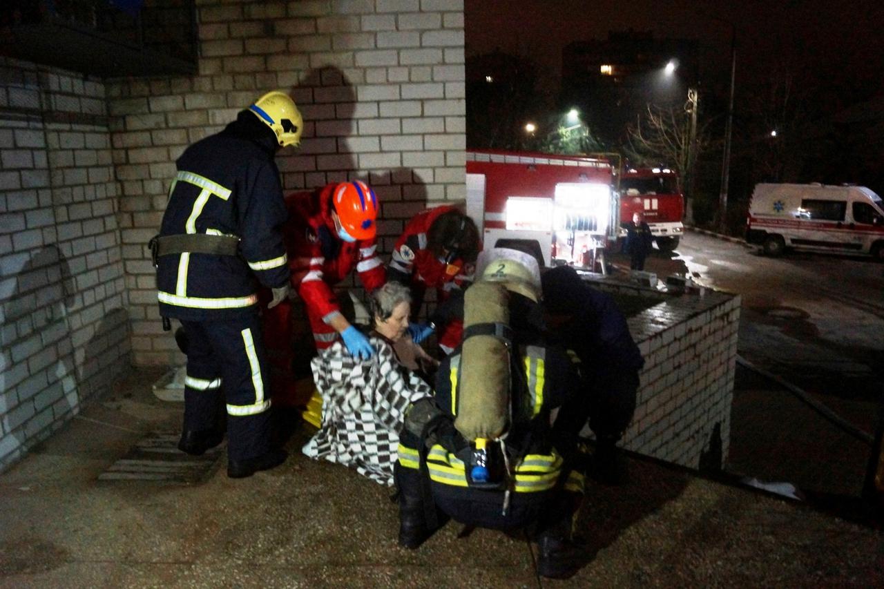 Rescuers and medics evacuate a patient after a fire at a hospital in Zaporizhzhia