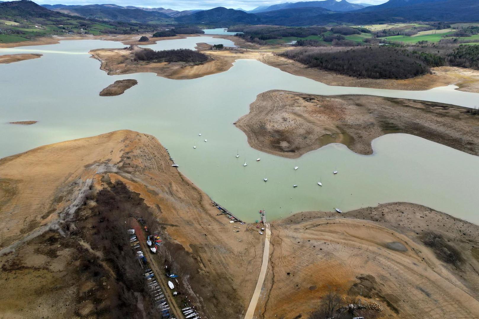 A view shows the partially dry Lake Montbel at the foot of the Pyrenees Mountains as France faces records winter dry spell raising fears of another summer of droughts and water restrictions, March 15, 2023. REUTERS/Sarah Meyssonnier Photo: Sarah Meyssonnier/REUTERS