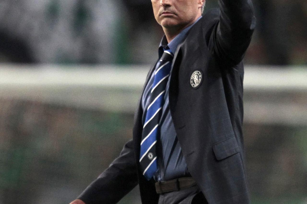 Chelsea's coach Jose Mourinho gestures after their Champions League Group G soccer match against Sporting Lisbon at the Estadio Jose Alvade in Lisbon, September 30, 2014.        REUTERS/Hugo Correia (PORTUGAL  - Tags: SPORT SOCCER)