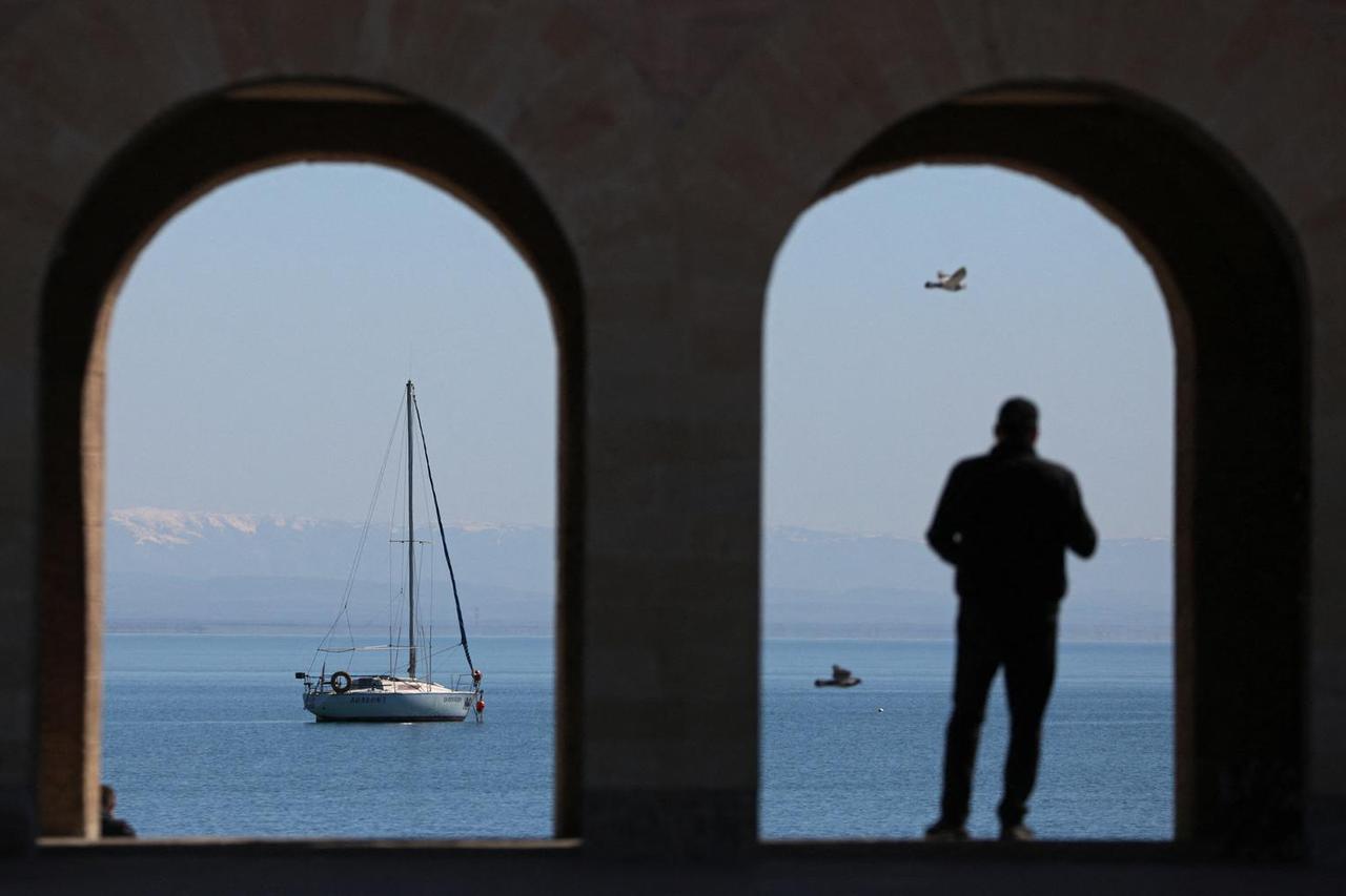 A man stands on the embankment in Yevpatoriya