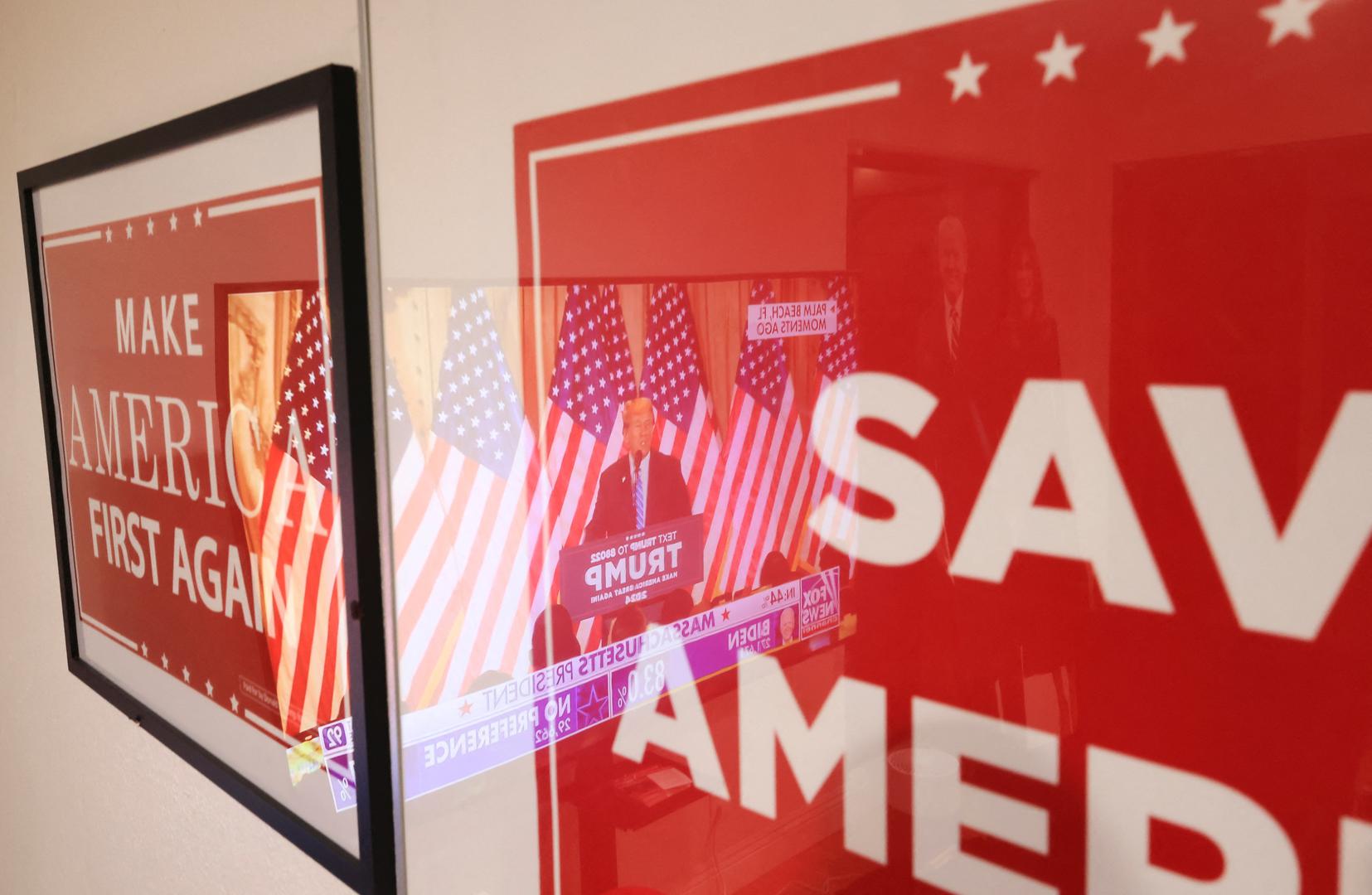 Former U.S. President Donald Trump is reflected on posters as he speaks on a TV screen at a watch party event to mark the Super Tuesday primary elections, in Long Beach, California, U.S., March 5, 2024. REUTERS/David Swanson Photo: DAVID SWANSON/REUTERS