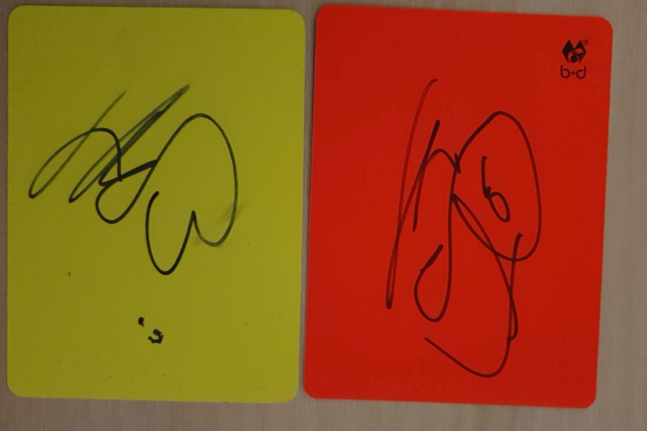 A handout image of cards signed by Borussia Dortmund striker Erling Haaland to raise money for autism charity