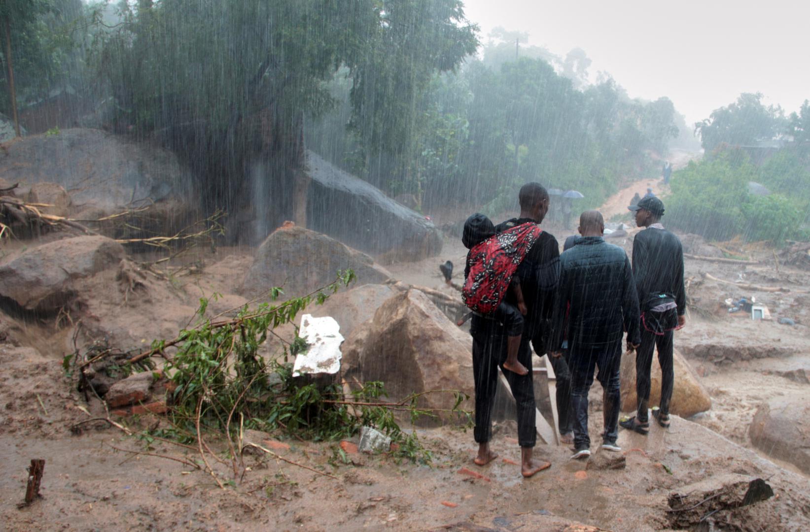 People look at the damage caused by Cyclone Freddy in Chilobwe, Blantyre, Malawi, March 13, 2023. REUTERS/Eldson Chagara. Photo: Eldson Chagara/REUTERS