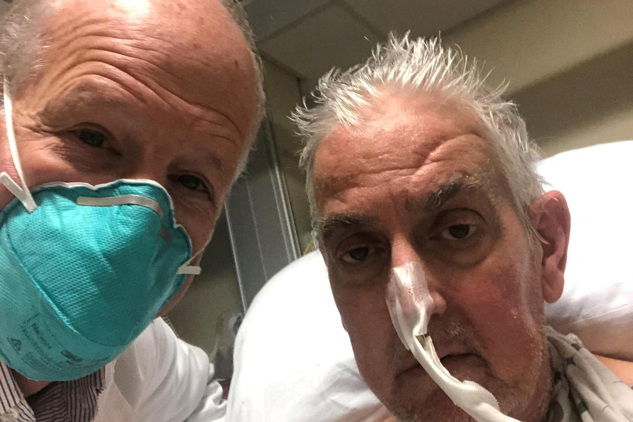 David Bennett poses with surgeon before pig heart transplant in Baltimore
