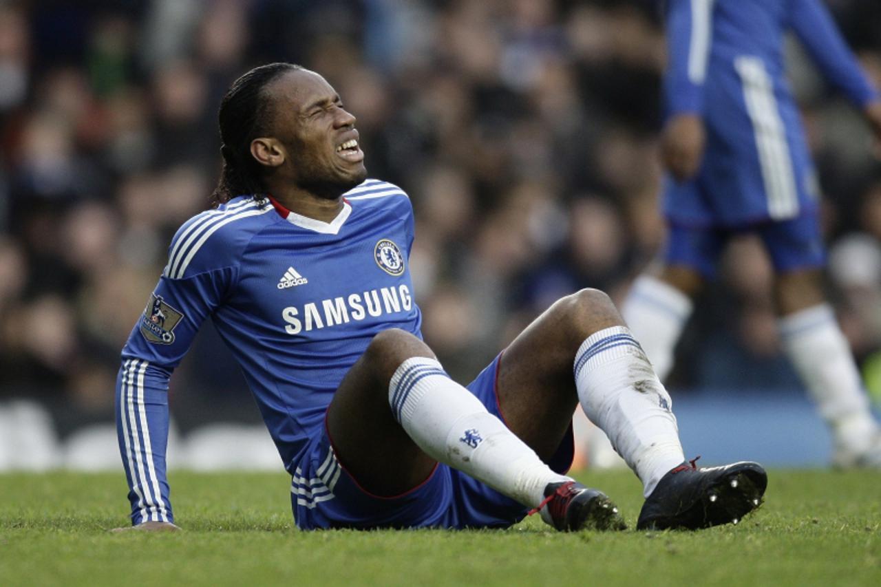 'Chelsea\'s Ivorian footballer Didier Drogba reacts after a challenge against Aston Villa during a Premier League match at Stamford Bridge in London, on January 2, 2011. AFP PHOTO/IAN KINGTON  FOR EDI