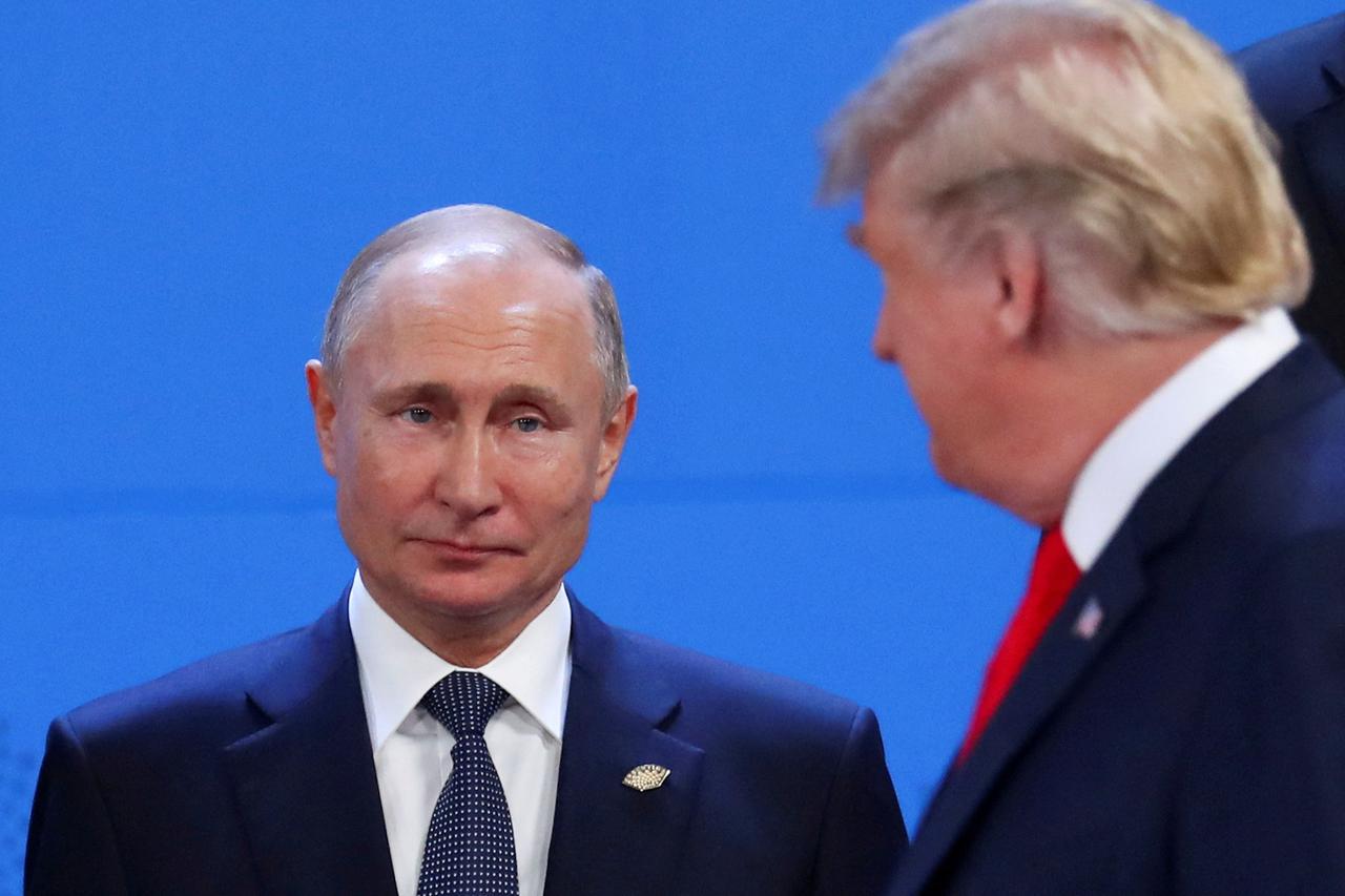 FILE PHOTO: Putin and Trump are pictured in 2018 in Argentina