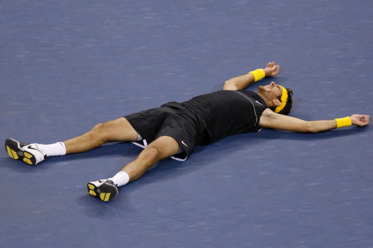 'Juan Martin del Potro of Argentina reacts after defeating Roger Federer of Switzerland in their men\'s singles final match at the U.S. Open tennis championship in New York, September 14, 2009.     RE