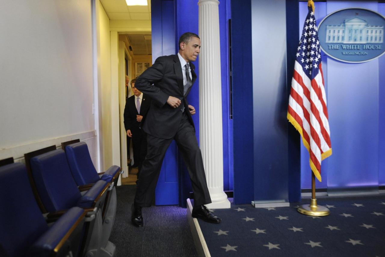 'U.S. President Barack Obama arrives for remarks on the congressional budget impasse the White House in Washington, April 6, 2011. Obama said an emergency White House meeting he convened late on Wedne