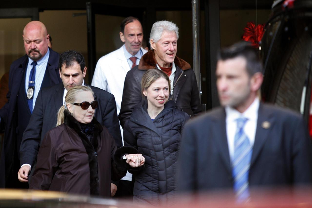 'U.S. Secretary of State Hillary Clinton (L) leaves New York Presbyterian Hospital with husband, Bill (TOP), and daughter, Chelsea (C), in New York, January 2, 2013. The secretary of state, who has no