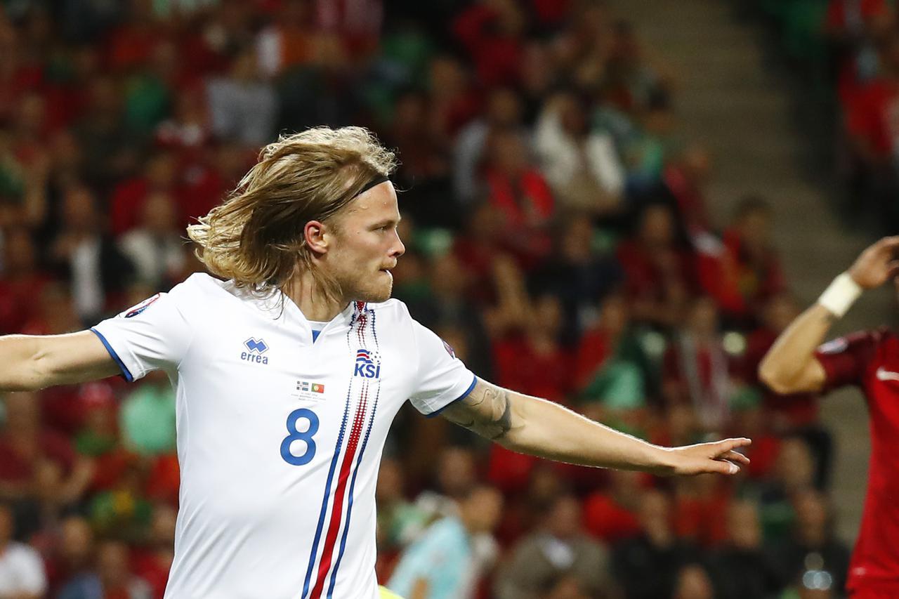 Football Soccer - Portugal v Iceland - EURO 2016 - Group F - Stade Geoffroy-Guichard, Saint-Étienne, France - 14/6/16 Iceland's Birkir Bjarnason celebrates after scoring their first goal  REUTERS/Kai Pfaffenbach Livepic