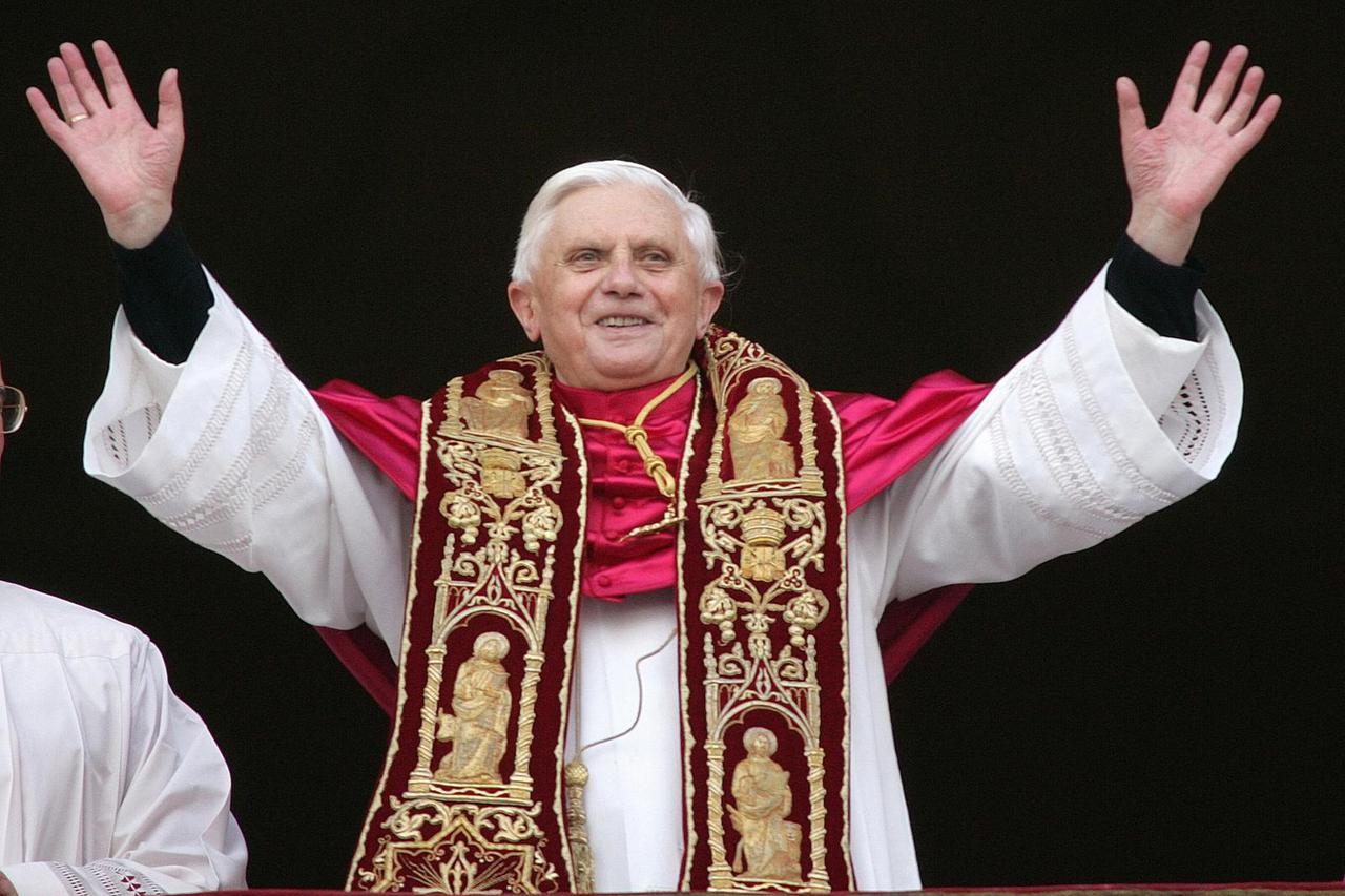 FILE PHOTO: Pope Benedict XVI, Cardinal Joseph Ratzinger of Germany, waves from a balcony of St. Peter's ...