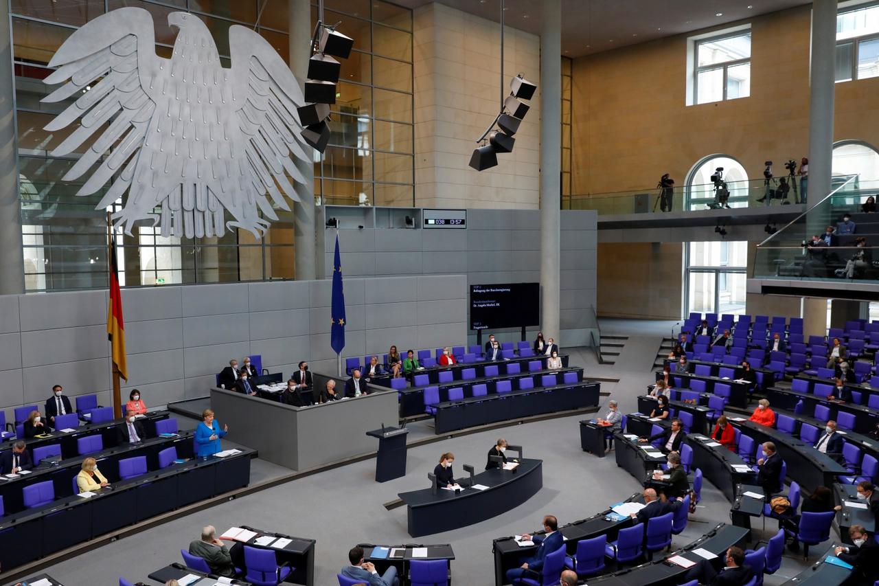 German Chancellor Angela Merkel attends the last session of the lower house of parliament Bundestag before federal elections, in Berlin