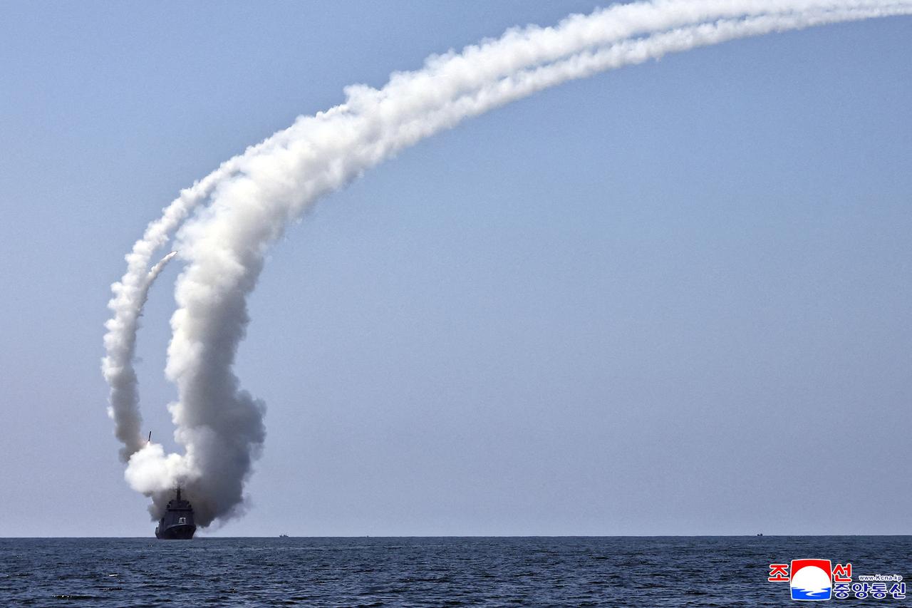 North Korean leader Kim Jong Un observes a cruise missile launch
