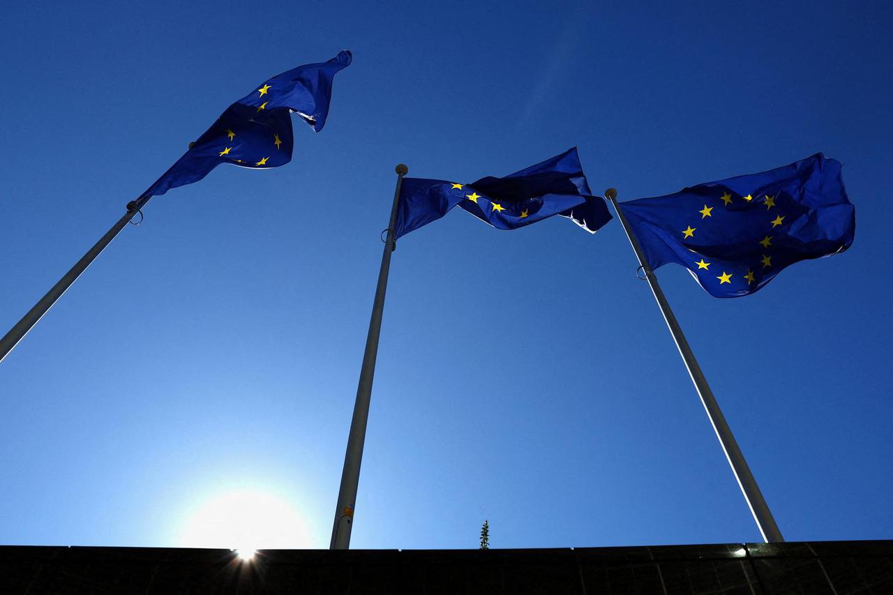 FILE PHOTO: European Union flags flutter outside the EU Commission headquarters in Brussels