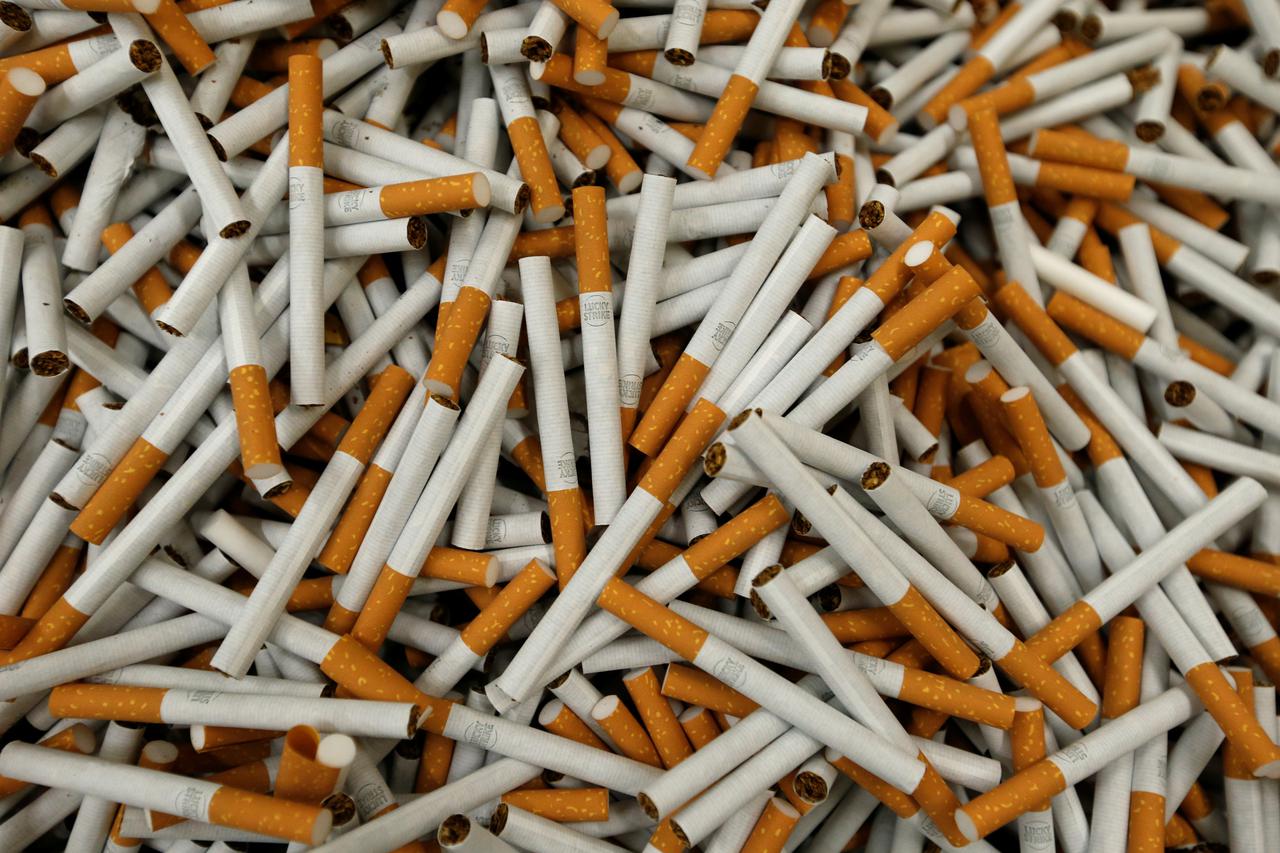 Lucky Strike cigarettes are seen during the manufacturing process in the British American Tobacco Cigarette Factory (BAT) in Bayreuth, southern Germany, April 30, 2014. REUTERS/Michaela Rehle/File Photo