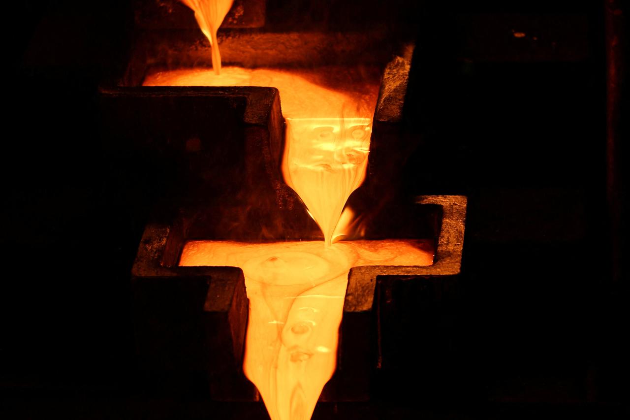 FILE PHOTO: Refined gold is poured into moulds to be made into gold bars at South Africa's Gold Fields South Deep mine in Westonaria