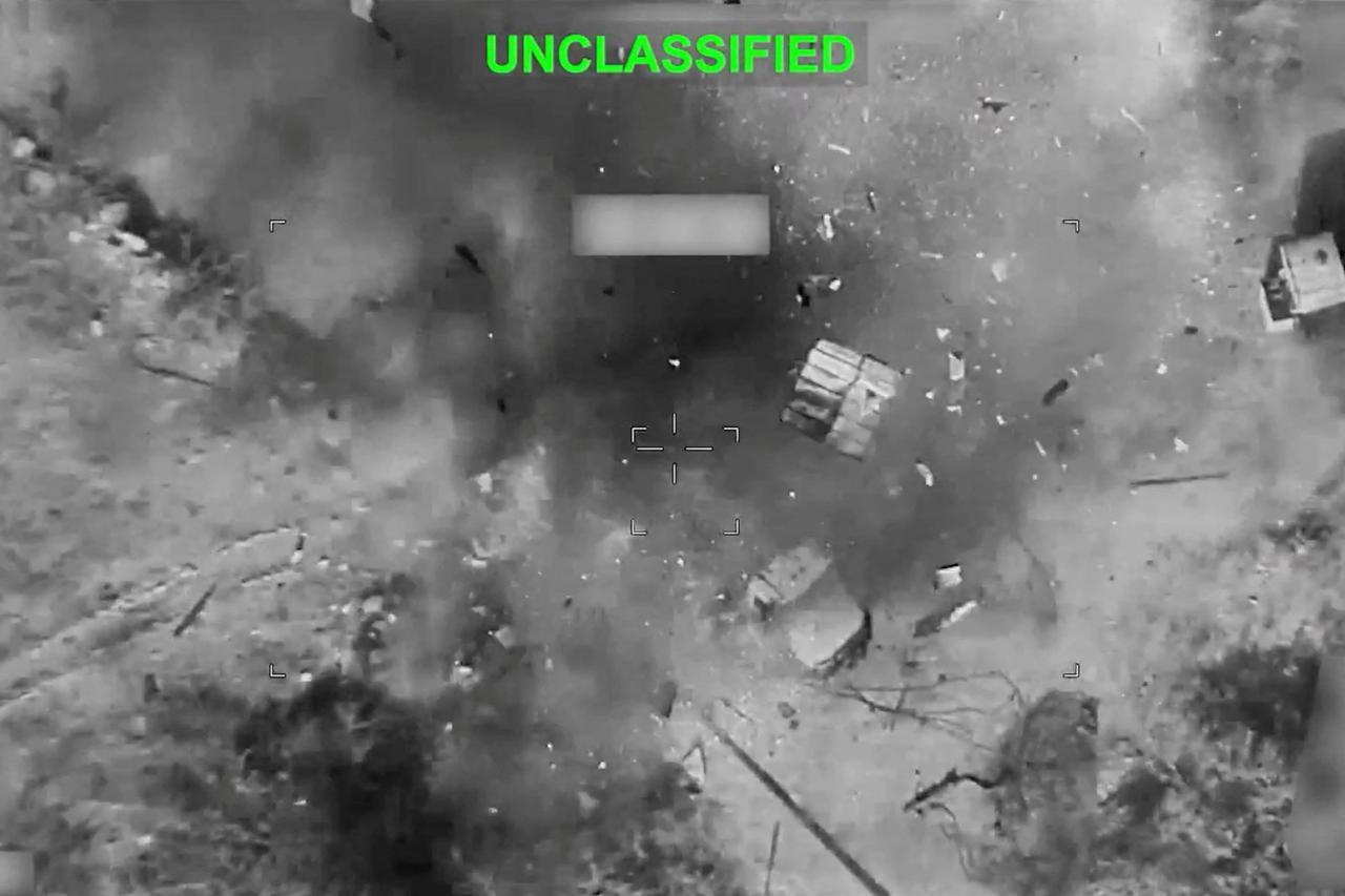 Smoke and debris rises following an explosion at the site of a reported strike