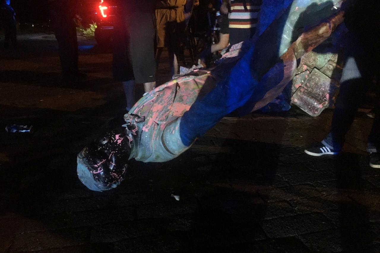 A statue of Confederate President Jefferson Davis defaced with paint after it was torn down, is seen in this picture obtained from social media June 10, 2020 in Richmond, Virginia