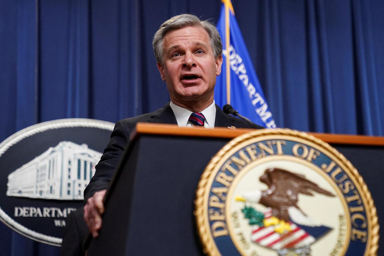 FBI Director Wray discusses charges against transnational crime group at the Justice Department in Washington