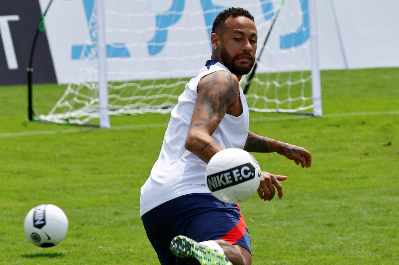 Paris St Germain's players at a kids soccer clinic during the team's tour of Japan, in Tokyo