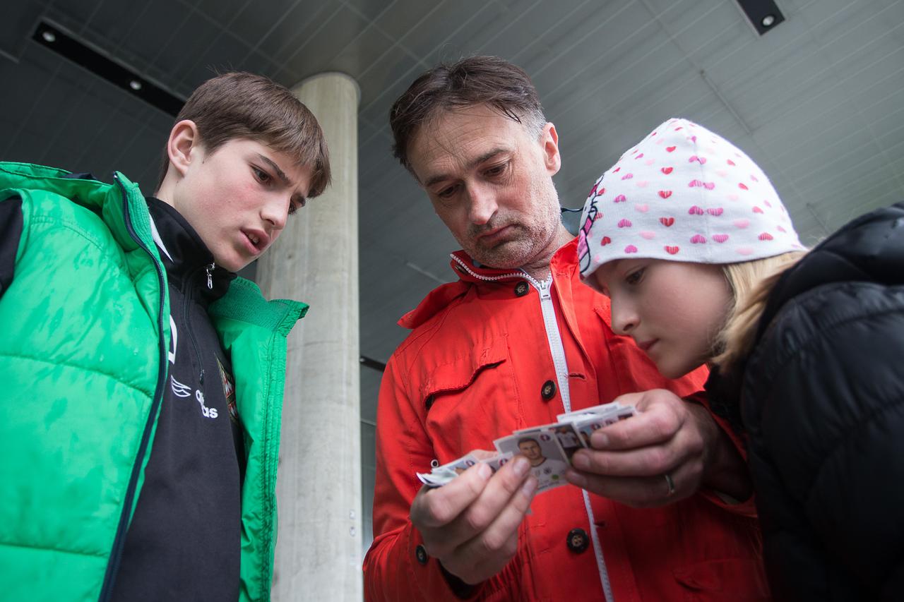 01.05.2016., Zagreb - Na platou Muzeja suvremene umjetnosti gradjani razmjenjuju slicice za album Euro 2016. Faris Plicanic sa kcerkom i sinom.  Photo: Davor Puklavec/PIXSELL