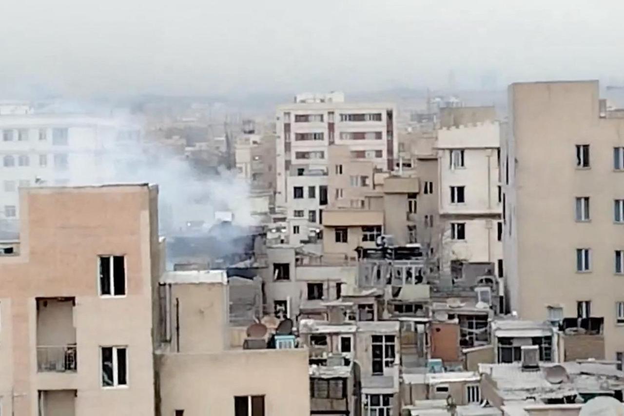 Smoke rises from a building following a reported strike, amid the U.S.-Israeli conflict with Iran, in Tehran