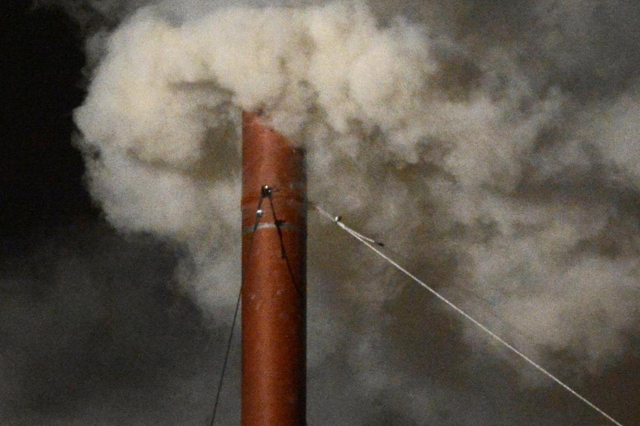 FILE PHOTO: White smoke rises from the chimney on the Sistine Chapel indicating that a new pope has been elected at the Vatican