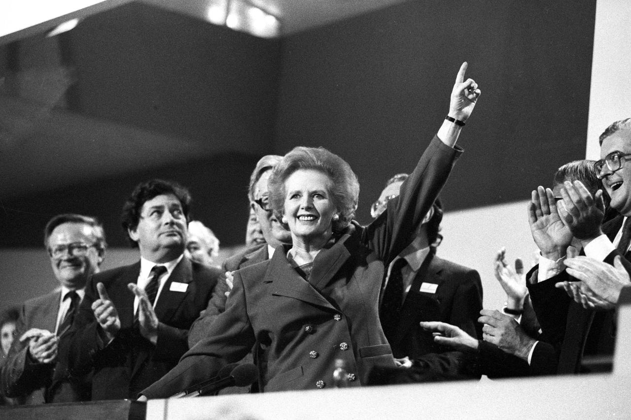 FILE PHOTO - British Prime Minister Margaret Thatcher points skyward as she receives standing ovation at Conservative Party Conference on October 13, 1989. REUTERS/Stringer/UK  BRITAIN - RTRCQJ3