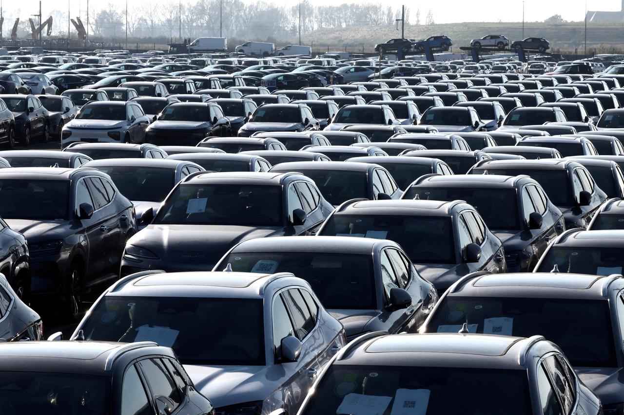 FILE PHOTO: New cars, among them new China-built electric vehicles of the company BYD, are seen parked in the port of Zeebrugge