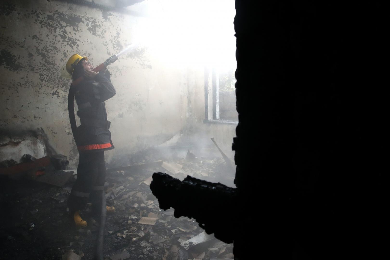 BARDA, AZERBAIJAN - OCTOBER 5, 2020: A firefighter battles a fire at a residential building damaged in a shelling attack. The situation in Nagorno-Karabakh escalated on September 27, 2020, with reports from Yerevan on the Azerbaijani troops advancing in the direction of Nagorno-Karabakh and shelling its settlements, including the capital city of Stepanakert. Both Azerbaijan and Armenia have declared martial law and military mobilization, reporting on casualties and injuries among civilians as well. Valery Sharifulin/TASS Photo via Newscom Newscom/PIXSELL