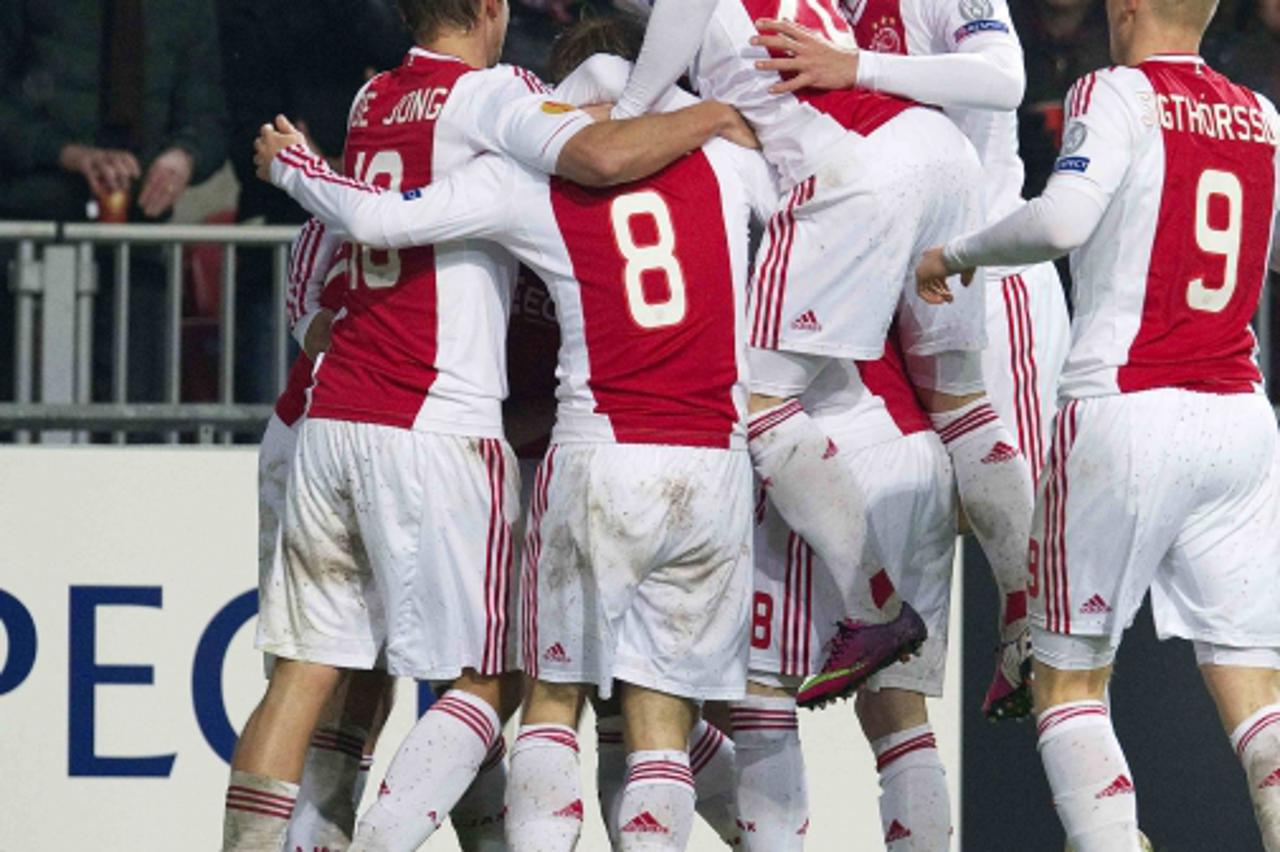 'Ajax Amsterdam players celebrate scoring against Steaua Bucharest during their Europa League soccer match in Amsterdam February 14, 2013. REUTERS/Toussaint Kluiters/United Photos (NETHERLANDS - Tags: