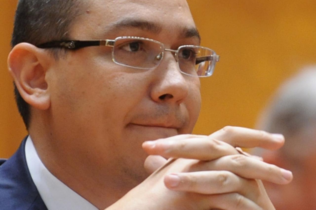 'Romanian prime minister-designate Victor Ponta attends a session of the Romanian Parliament in Bucharest on May 7, 2012. Romania\'s new centre-left government will seek formal approval from parliamen