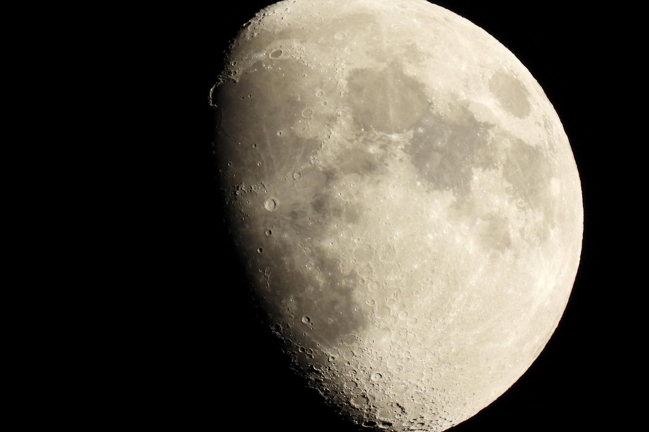 FILE PHOTO: The craters on the surface of the crescent moon are seen from the northern hemisphere as it rises in the sky over Ronda