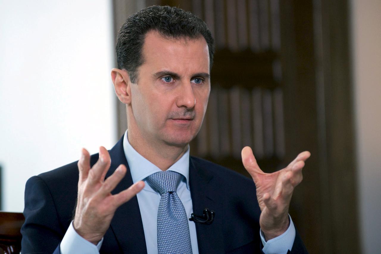 Syria's President Bashar al-Assad speaks during an interview with Russia's RIA new agency, in Damascus, Syria in this handout file picture provided by SANA on March 30, 2016. To match Insight MIDEAST-CRISIS/SYRIA   REUTERS/SANA/Handout via Reuters/Files  
