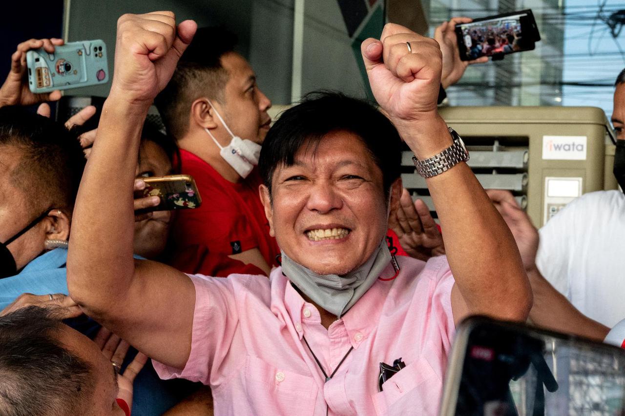 Philippine presidential candidate Ferdinand "Bongbong" Marcos Jr., son of late dictator Ferdinand Marcos, greets his supporters at his headquarters in Mandaluyong City