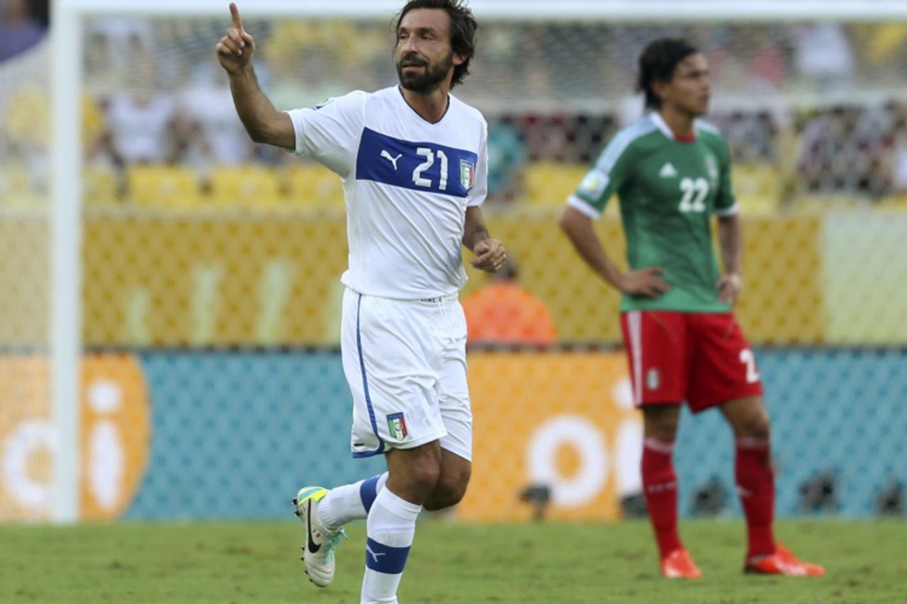 'Italy\'s Andrea Pirlo (L) celebrates his free kick goal during their Confederations Cup Group A soccer match against Mexico at the Estadio Maracana in Rio de Janeiro June 16, 2013.  REUTERS/Pilar Oli