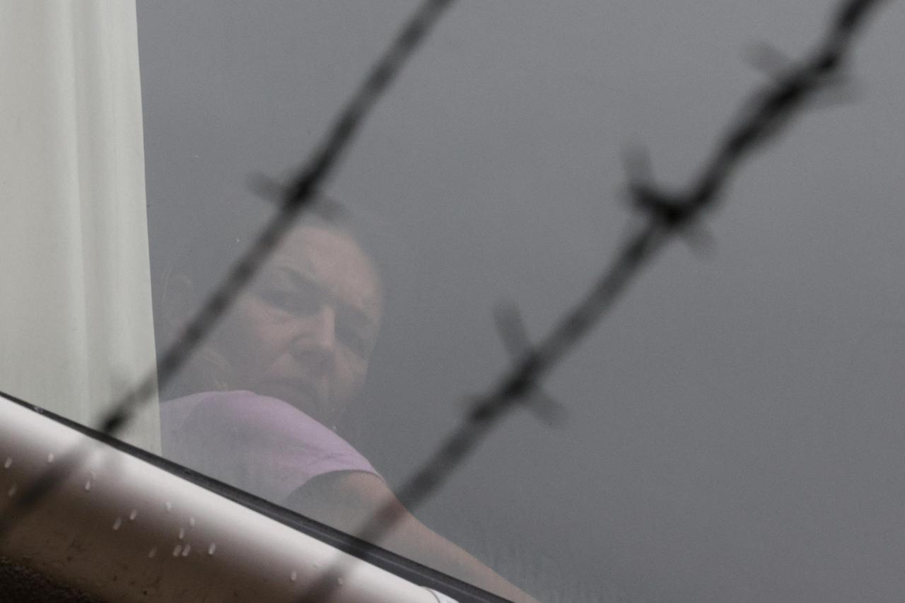FILE PHOTO: Tennis player Renata Voracova looks out a window from the Park Hotel in Melbourne