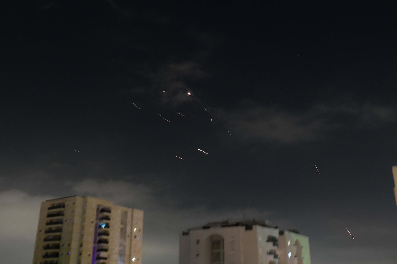 (240414) -- TEL AVIV, April 14, 2024 (Xinhua) -- This photo taken on April 14, 2024 shows flares from explosions in the sky over Tel Aviv as Israel's anti-missile system intercepts missiles and drones from Iran. A combined attack of dozens of ballistic missiles and hundreds of drones from Iran triggered air raid alerts across Israel early on Sunday, the Israeli army said, as residents reported multiple bombings were heard.    Israel Defense Forces (IDF) Spokesman Daniel Hagari confirmed during a press briefing that Israel was under attack by ballistic missiles and unmanned aerial vehicles from Iran, noting that aerial defense systems have intercepted some of the missiles. (Tomer Neuberg/JINI via Xinhua) Photo: Tomer Neuberg/JINI/XINHUA
