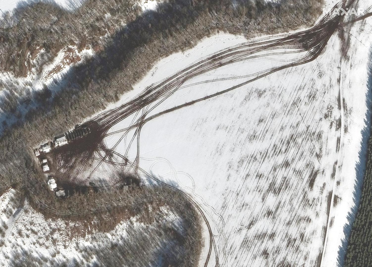 A satellite image shows deployment along a tree line, near Belgorod, Russia February 20, 2022. Maxar Technologies/Handout via REUTERS ATTENTION EDITORS - THIS IMAGE HAS BEEN SUPPLIED BY A THIRD PARTY. NO RESALES. NO ARCHIVES. MANDATORY CREDIT. DO NOT OBSCURE LOGO Photo: MAXAR TECHNOLOGIES/REUTERS