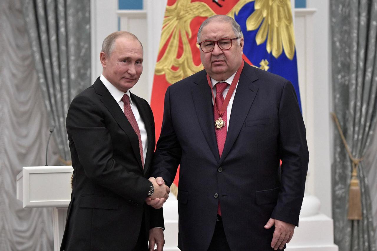 FILE PHOTO: Russian President Putin and Russian businessman Usmanov attend an awarding ceremony in Moscow