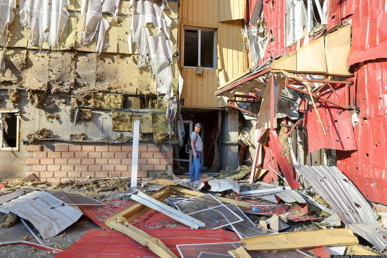 A view shows a damaged residential building in Donetsk