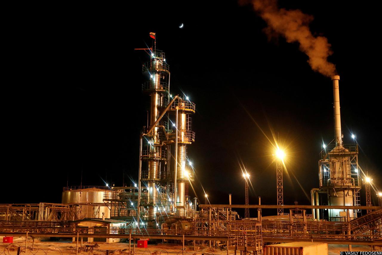 FILE PHOTO: A Russian state flag flies on the top of a diesel plant in the Irkutsk Oil Company-owned Yarakta Oil Field in Irkutsk Region