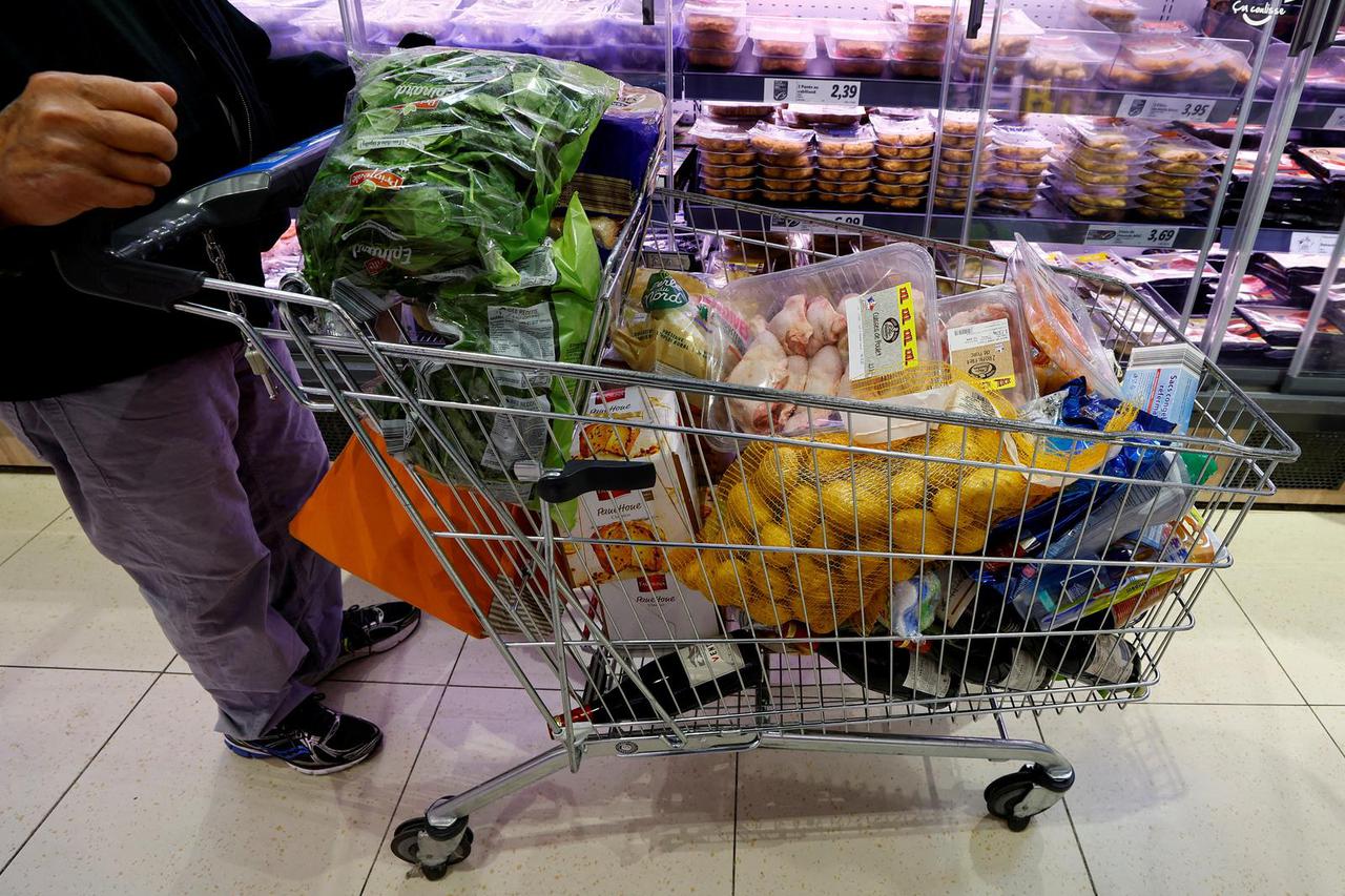 FILE PHOTO: Customers shop in a Lidl supermarket near Nice