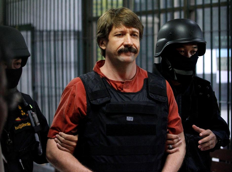 FILE PHOTO: Suspected Russian arms dealer Viktor Bout is escorted by members of a special police unit after a hearing at a criminal court in Bangkok