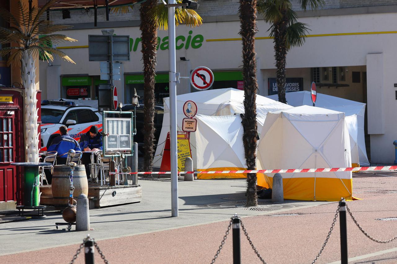 Police officers take notes next to tents in Montreux
