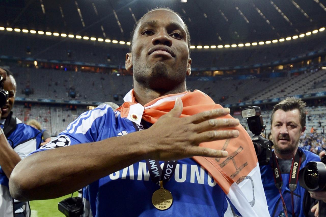 'Didier Drogba of Chelsea celebrate after his team's Champions League final soccer match against Bayern Munich at the Allianz Arena in Munich, May 19, 2012. REUTERS/Dylan Martinez (GERMANY  - Tags: S