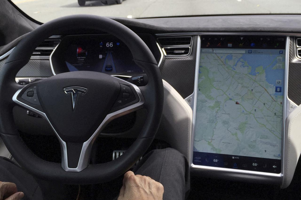 FILE PHOTO: The interior of a Tesla Model S is shown in autopilot mode in San Francisco